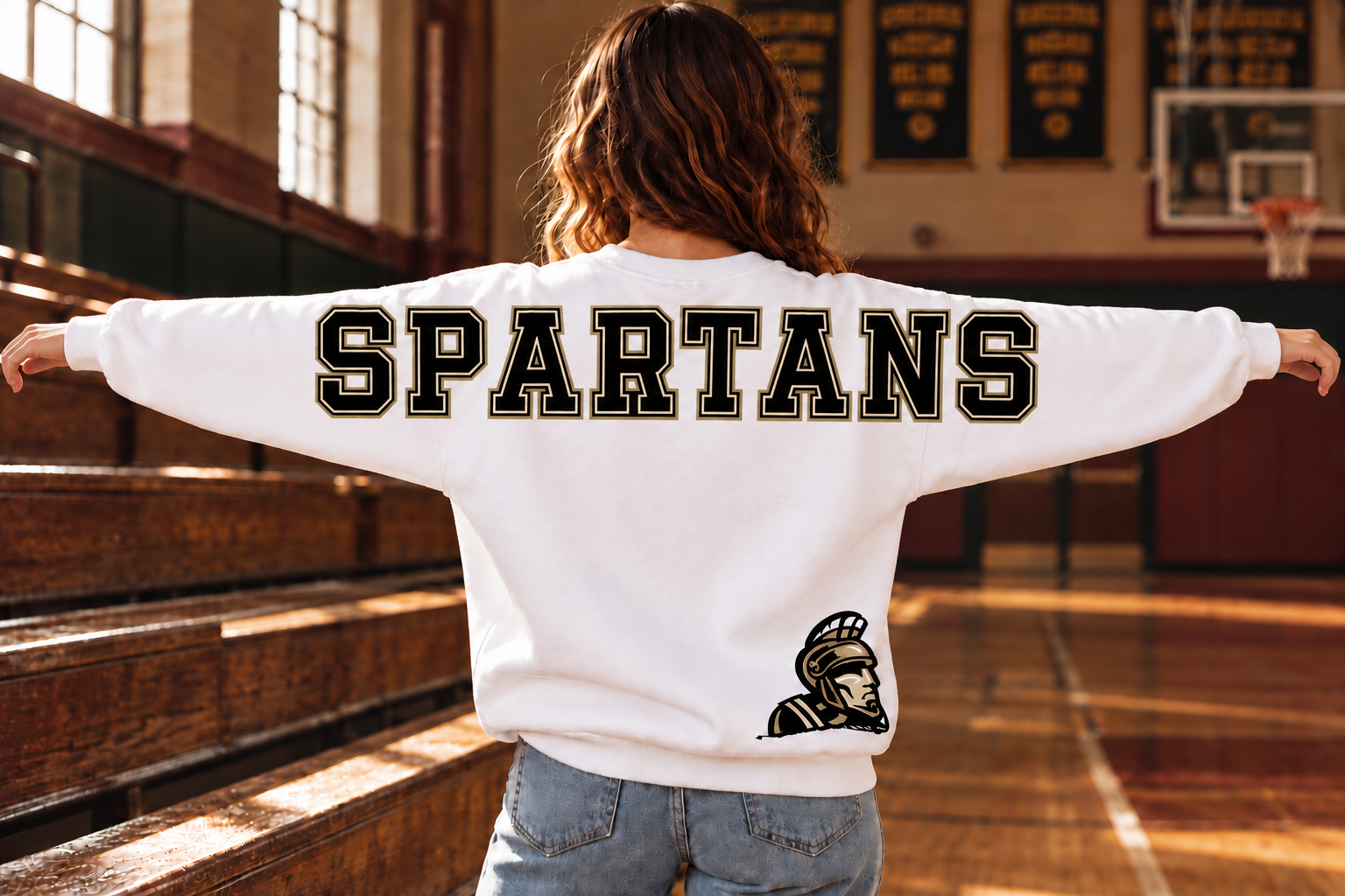 SPARTANS lettering across the back and upper sleeves of a white crewneck
